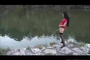 Girl pissing in standing water