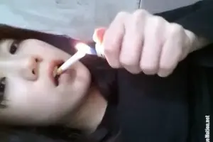 Young Asian girl smokes and poops