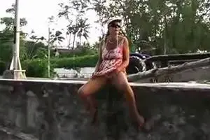Woman pissing in townthumb img