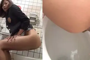 Cute asian girl pushing and pooping in the toilet