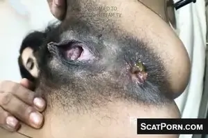 Girl with a black hairy pussy farts and poops